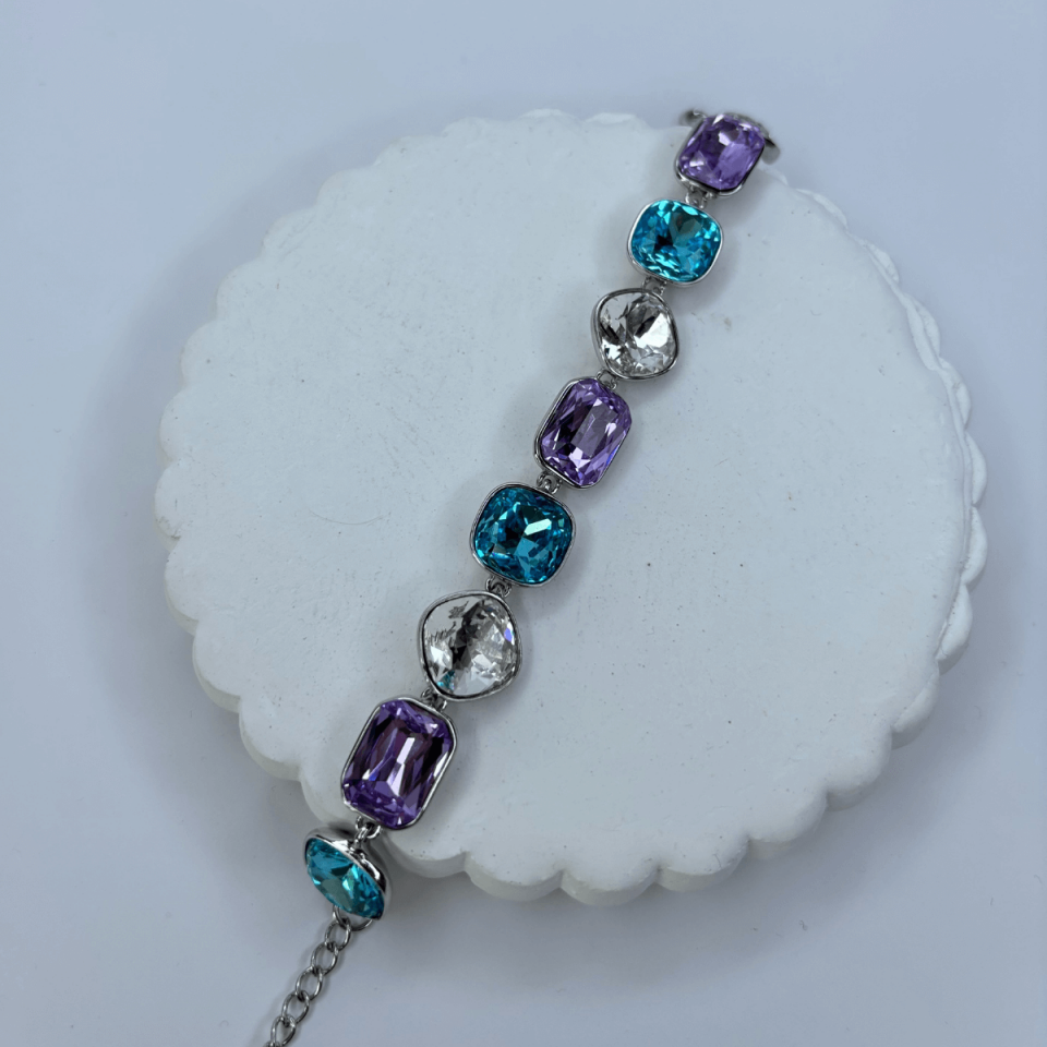Mavi ve Mor Tonlarında Parlak Taşlı Şekilli Silver İthal Bileklik